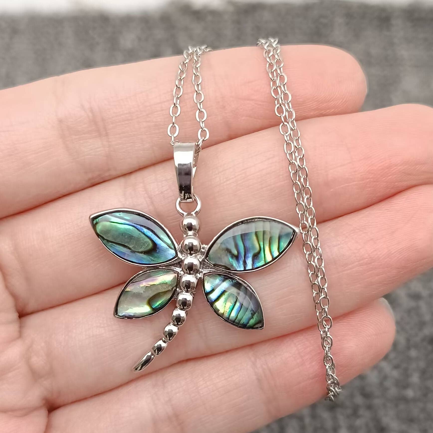 Front of the natural abalone shell dragonfly pendant necklace