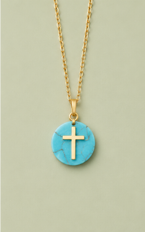 Turquoise natural stone cross necklace on a soft sage background