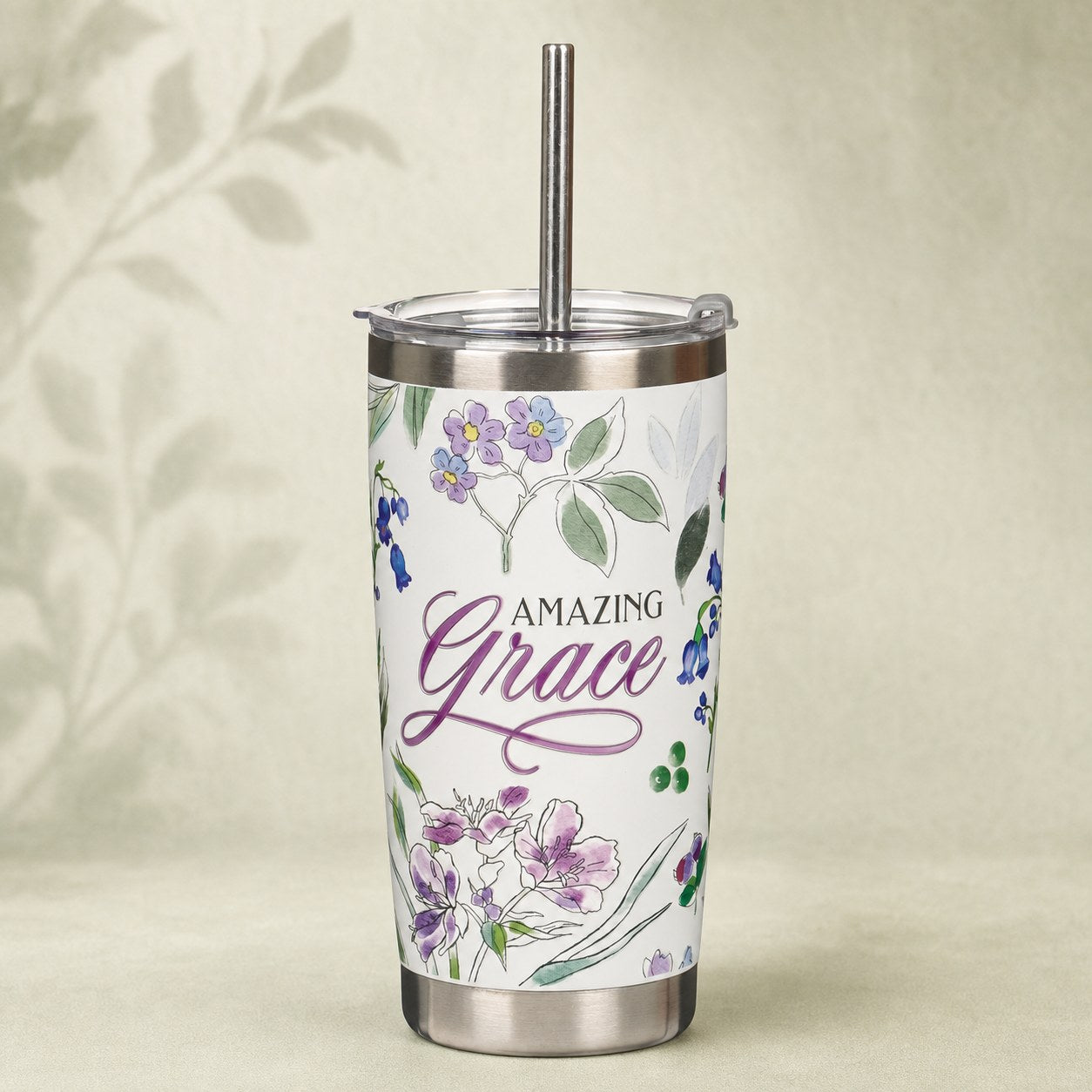 Purple Amazing Grace tumbler with straw on a warm sage and cream background